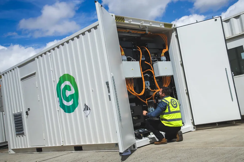 Man working on Connected Energy energy storage system using second life EV batteries